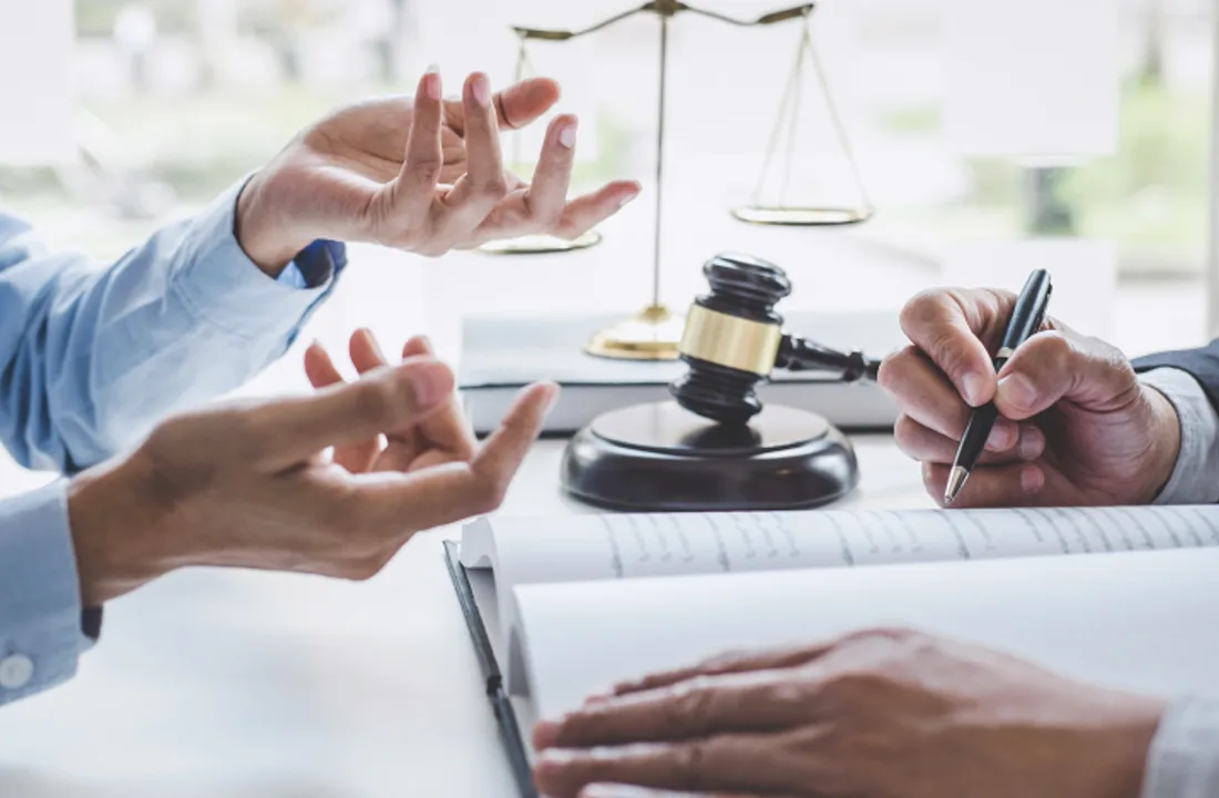 A focused legal consultation around a desk
